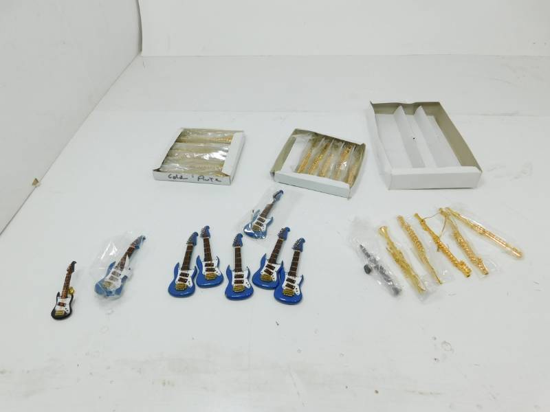 lot 57 image: Golden Flutes & Blue Electric Guitars Ornaments