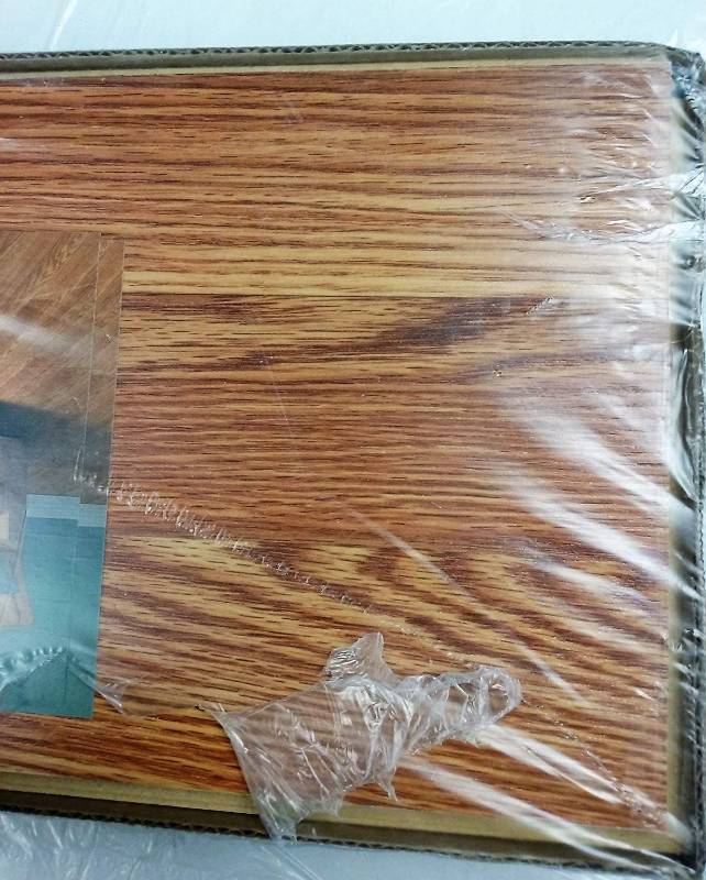 lot 21 image: Harmonics Sandstone Oak Laminate Flooring, Retail $29.99