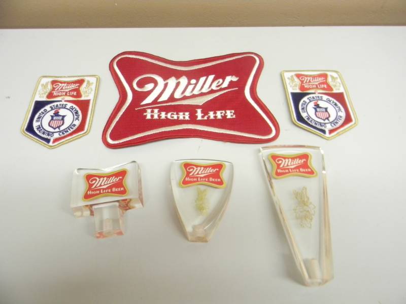 lot 67 image: NOS - VINTAGE MILLER HIGH LIFE 3 PATCHES & 3 TAP HANDLES - NICE - SEE PICTURES