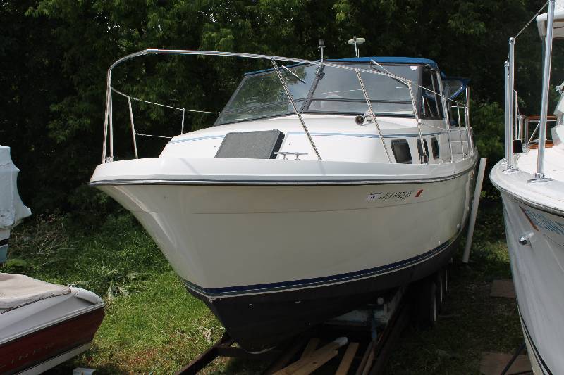 1988 28 foot Carver Riveria 28 Cabin Cruiser on a Tri-axle Custom Trailer.
