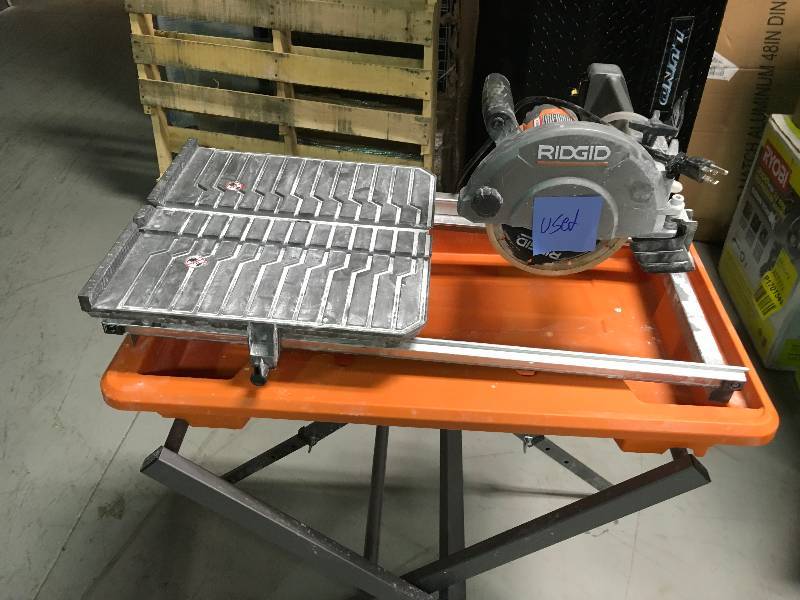 lot 84 image: Ridgid  7 in. Tile Saw with Stand USED  in good condition