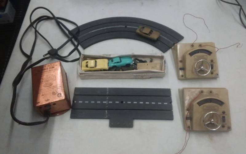 lot 56 image: Vintage Slot Cars & Parts, 2-Pieces Track, Power Supply & Controllers