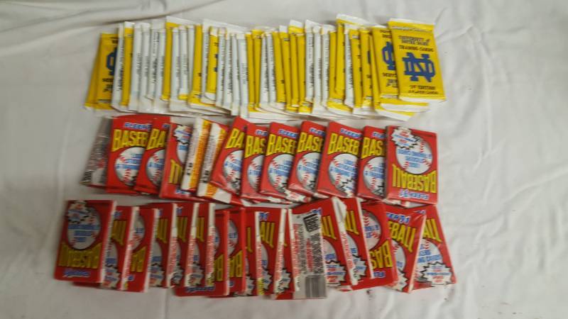 lot 76 image: 30-Unopened 1991 Baseball Card Packs, 31-Unopened U Of Notre Dame Player Cards