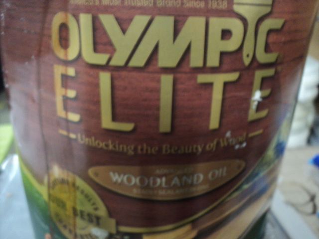 lot 142 image: 1 gallon Olympic Elite Woodland oil...