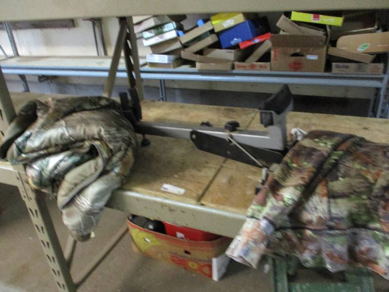 lot 53 image: Gun rest and 2 camo coats