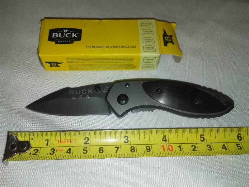 lot 28 image: Buck knife foldable pocket knife.