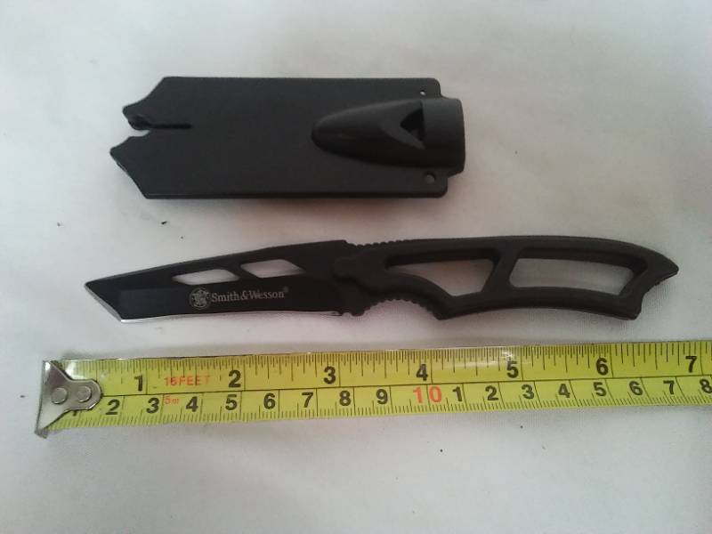 lot 34 image: Smith & Wesson buck knife with ABS plastic protector sheath.
