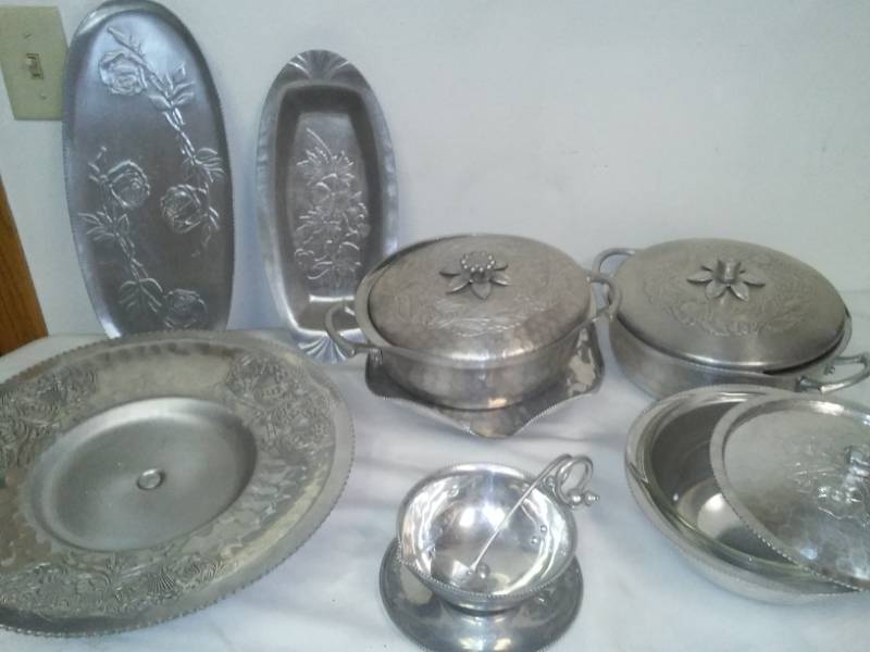 lot 47 image: 13 Piece Hammered Aluminum, one with Pyrex glass insert.