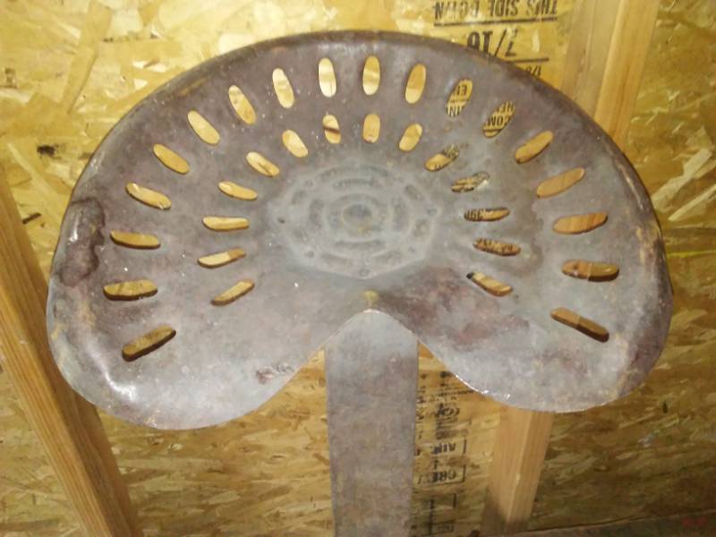 lot 110 image: Vintage tractor seat and mount.
