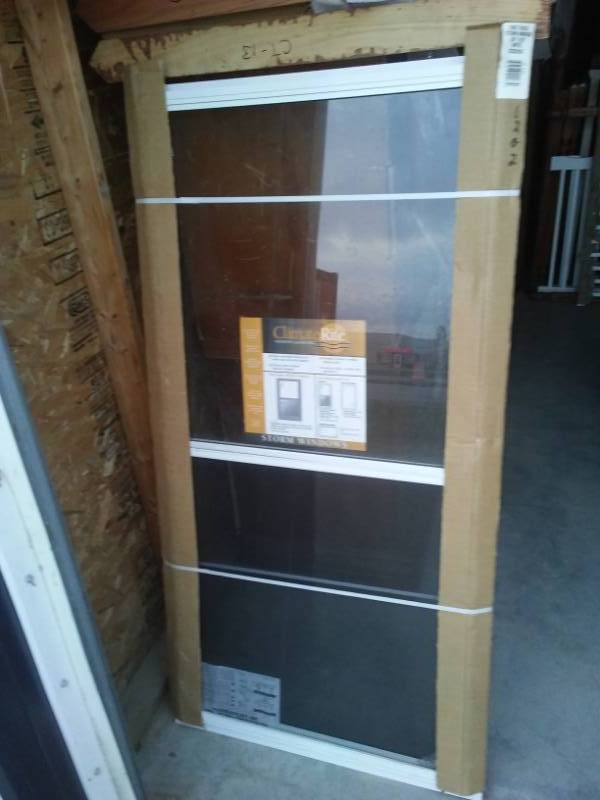 lot 146 image: Storm window, new, 28 x 55.