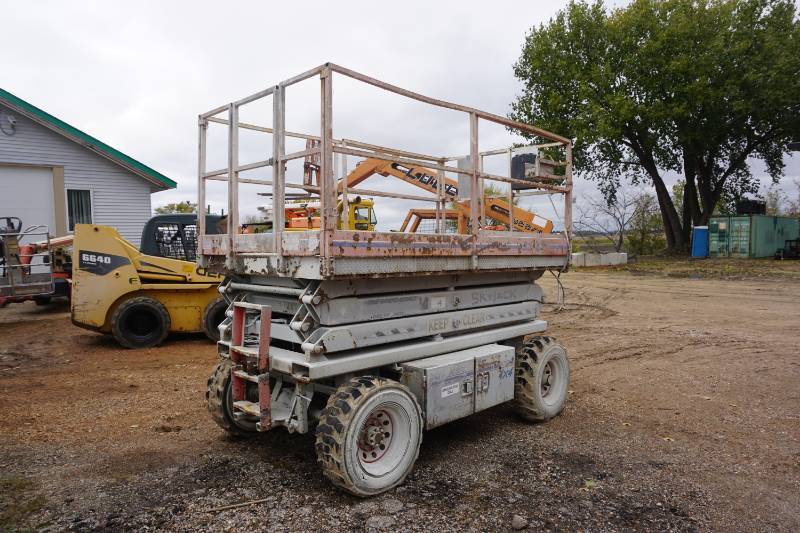 lot 9 image: 2000 Sky Jack Model SJ 7027 Rough Terrain Scissors Lift