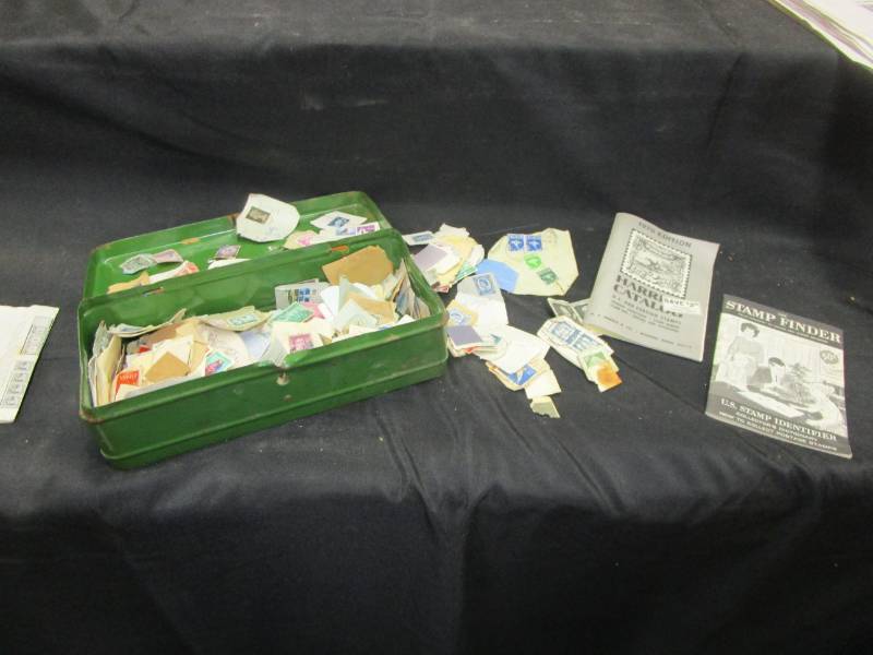 lot 27 image: Green Metal box full of used stamps