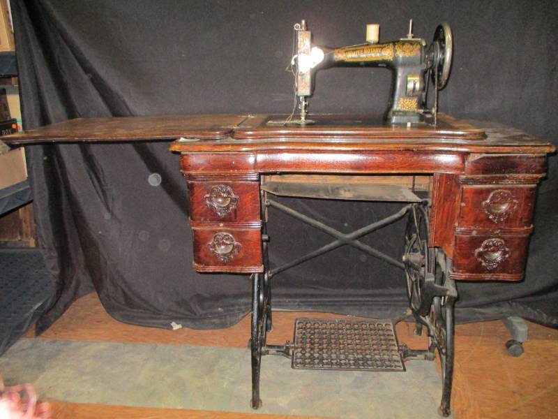 lot 42 image: Antique White Rotary Made in The USA Tredle Sewing Machine and Cabinet