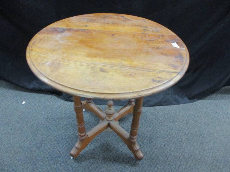 lot 126 image: Table with beautiful spindles and white wheels