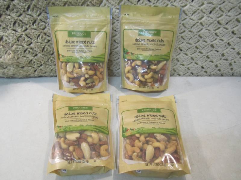 lot 111 image: 4 Bags of Deluxe Mixed Nuts Best by...