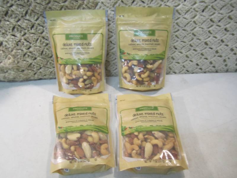 lot 113 image: 4 Bags of Deluxe Mixed Nuts Best by...