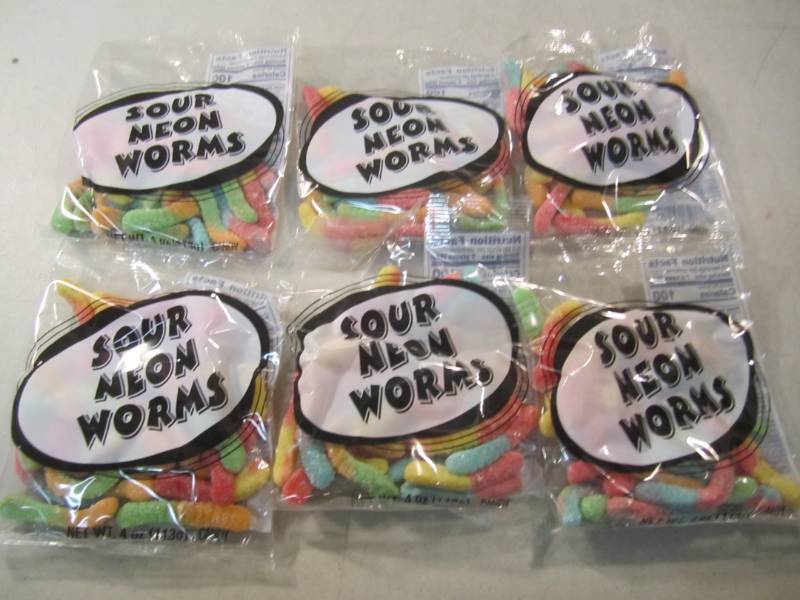 lot 139 image: 6 Bags of Sour Neon Worms Best by F...