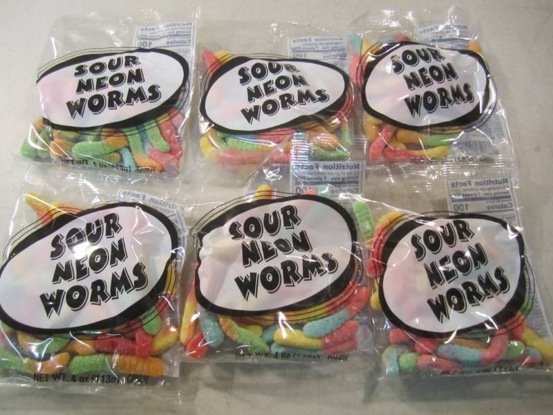 lot 140 image: 6 Bags of Sour Neon Worms Best by F...