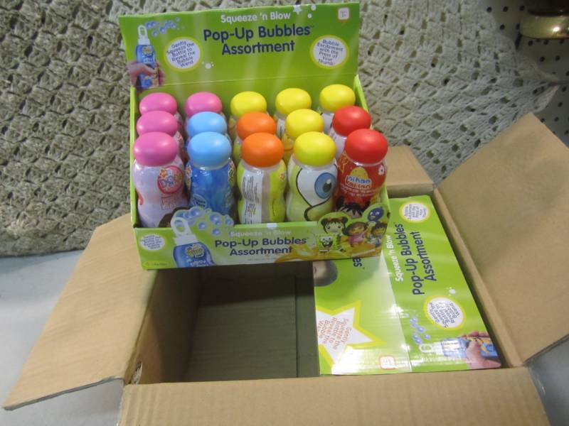 lot 162 image: Case of 30 Squeeze N Blow Pop-Up B...