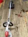 lot 120 image: Milwaukee M18 FUEL 18-Volt Lithium-Ion Brushless Cordless String Trimmer Kit with 9.0Ah Battery and Rapid Charger in working conditions
