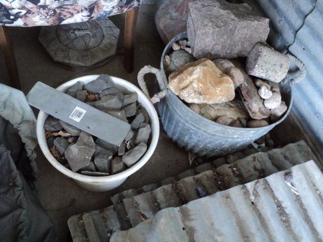 lot 14 image: metal tub and pot filled with rocks...