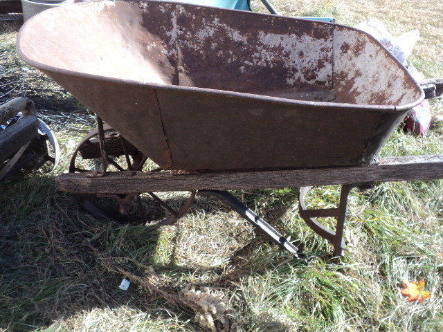lot 31 image: vintage wheel barrow...