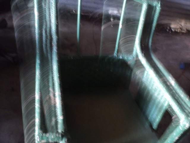 lot 74 image: green wicker rocker with wood seat...