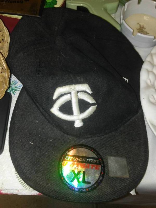 lot 35 image: The ultimate miscellaneous, NEW Twins cap, hockey pads, Mickey Mouse and More