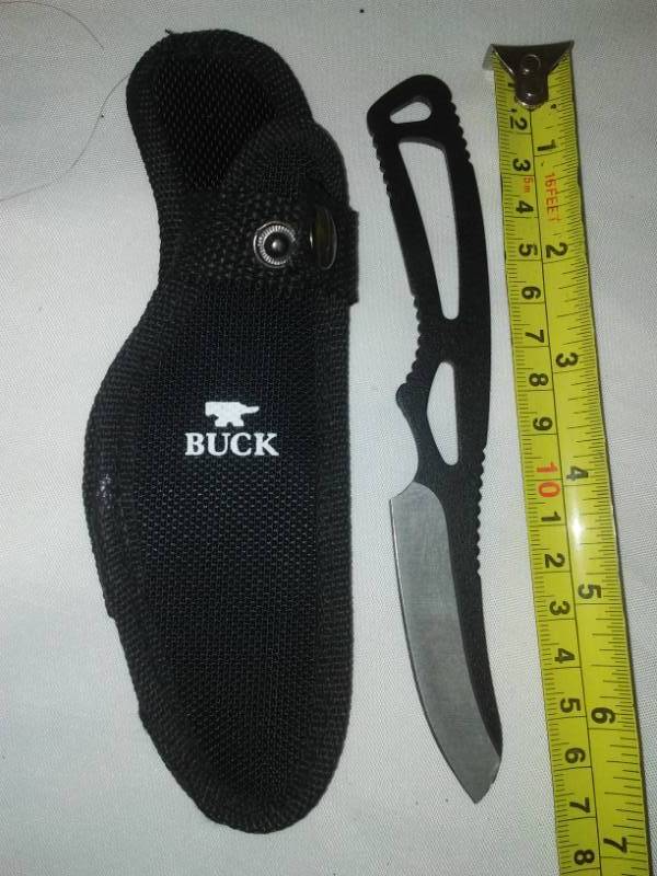 lot 49 image: Buck knife with nylon sheath.