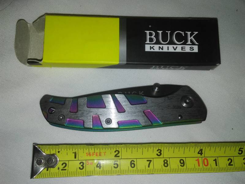 lot 51 image: Buck knife folding pocket knife with inlaid color accents - rare.
