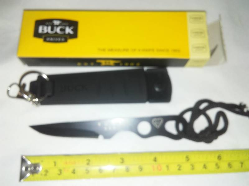 lot 52 image: Buck knife straight blade with rubber and poly sheath, belt clip and cord.