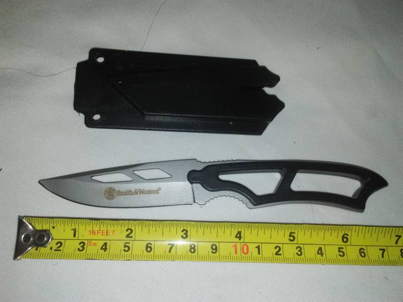 lot 54 image: Smith & Wesson straight knife with poly sheath.