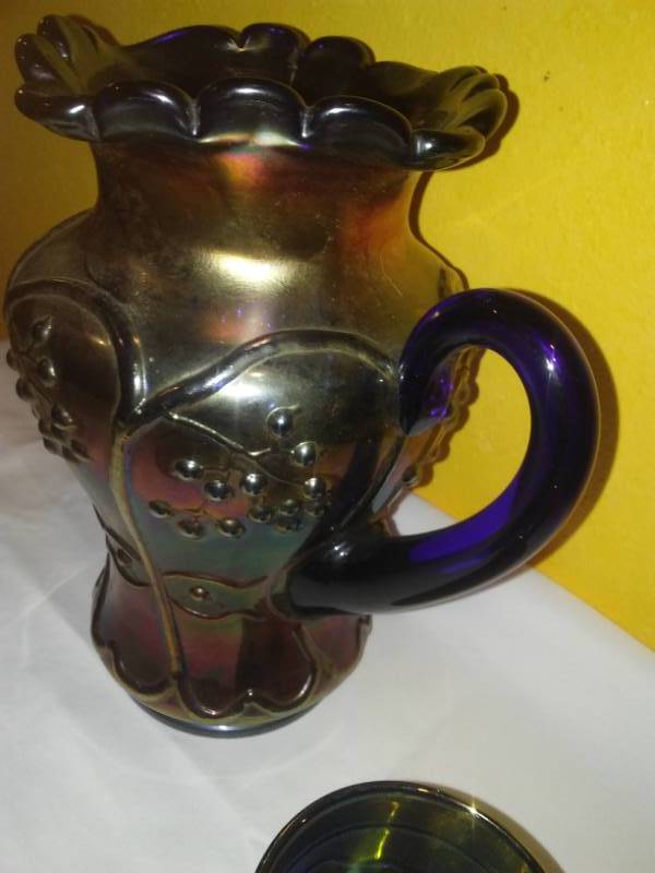 lot 105 image: Blue carnival glass, pitcher and 5 tumblers.