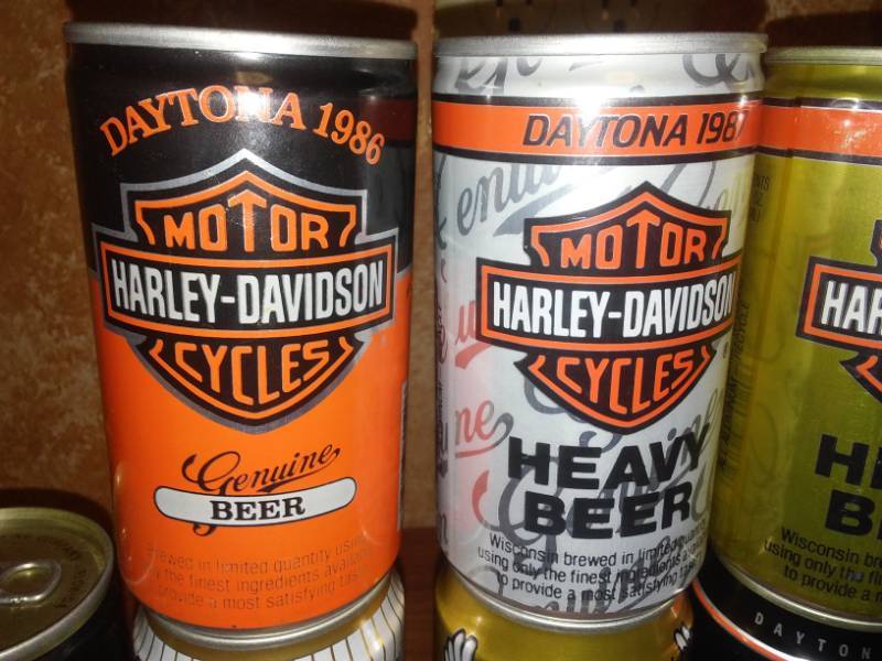 lot 129 image: 8 Harley-Davidson Daytona beer cans - 1986 to 1993.