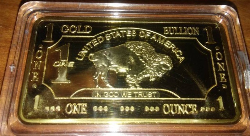 lot 223 image: NDSU Bison gold 1 troy ounce 100 Mills .999 fine gold.