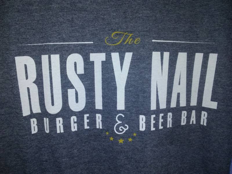 lot 230 image: 2 large 44 in chest, new t-shirts Rusty Nail burger and beer bar in Battle Lake.