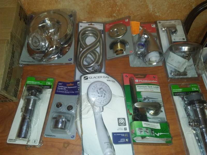 lot 239 image: New plumbing supplies, shower heads and more.