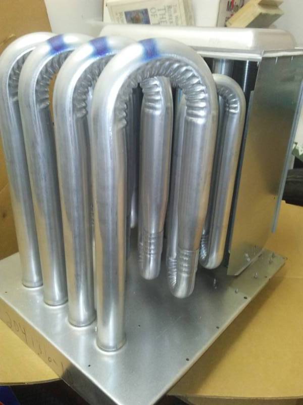 lot 253 image: HVAC heat exchanger, new in box.