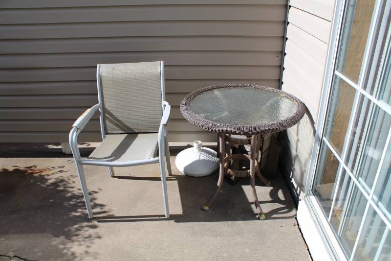 lot 302 image: Glass Top Patio Table, 2-Stacking Patio Chairs, Umbrella Stand
