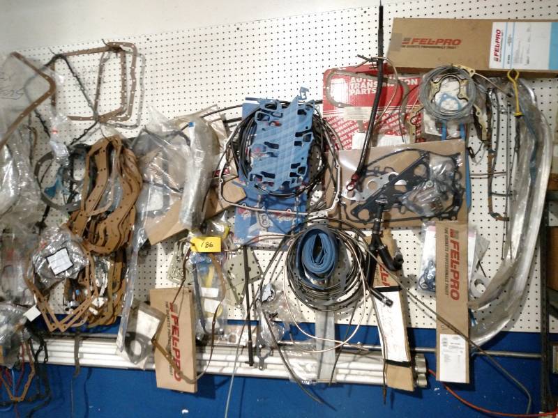 lot 186 image: Asstd Transmission Parts on Wall...