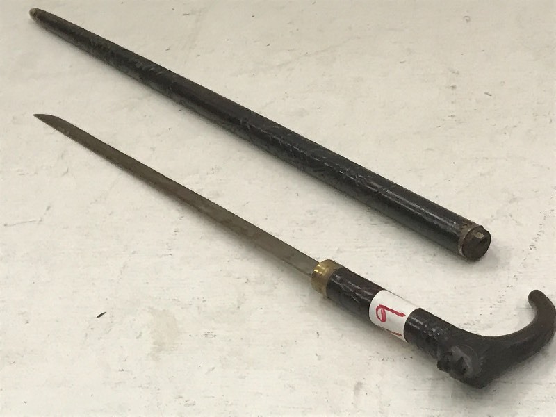 lot 49 image: Hand-Carved Walking Cane Sword With...