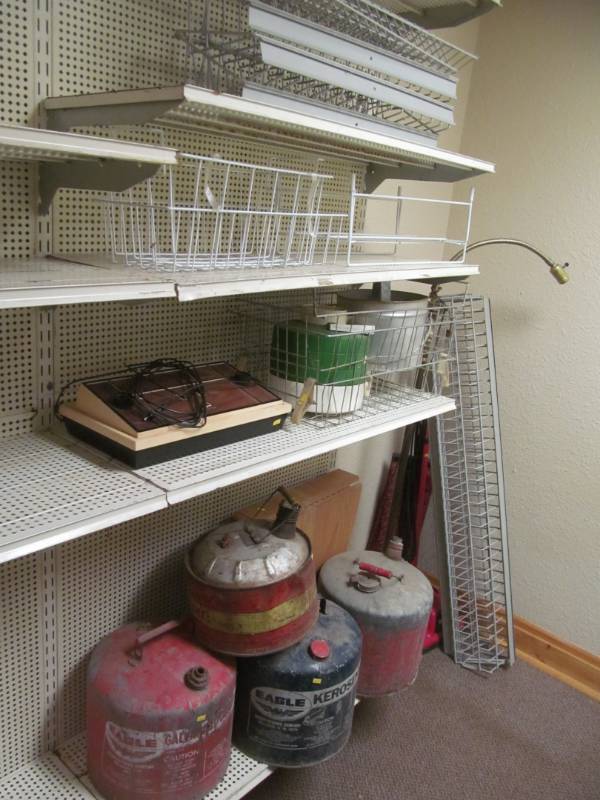 lot 4 image: Shelving racks, vintage gas cans, lamp, vintage sports tv game, Dirt Devil vaccumm