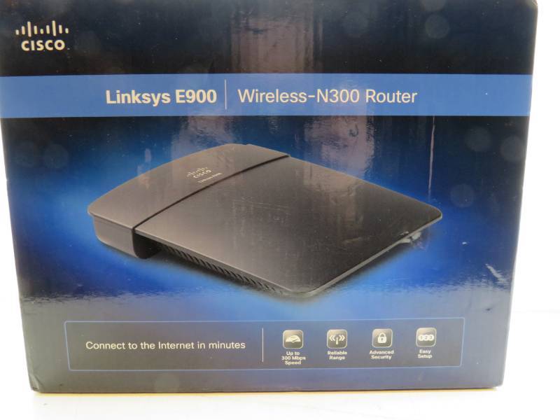 lot 48 image: Linksys E900 router, RCA Cables, and a CCTV Camera