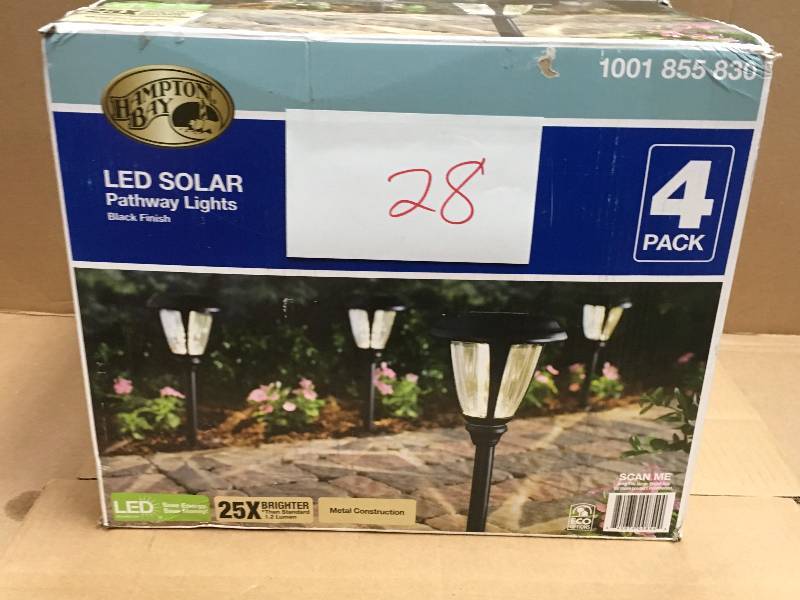 lot 28 image: Solar Black Outdoor Integrated LED 3000K 30-Lumens Landscape Path Light with Glass Lens (4-Pack) USED