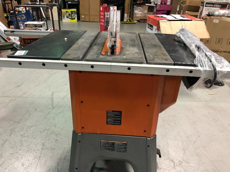 lot 112 image: RIDGID 13 Amp 10 in. Professional Cast Iron Table Saw in good condition
