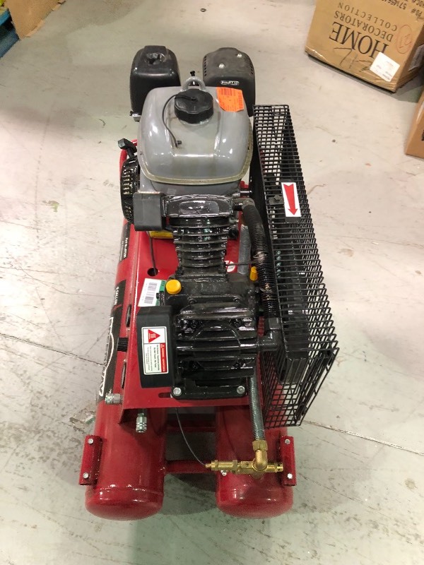 lot 117 image: SPEEDWAY 9 Gal. 6.5 HP OHV Wheelbarrow Design Gas Air Compressor with Run-Flat Tire in working conditions missing handle
