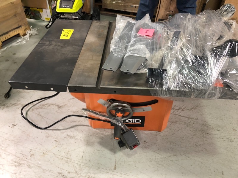 lot 113 image: RIDGID 13 Amp 10 in. Professional Cast Iron Table Saw no working conditions missing parts