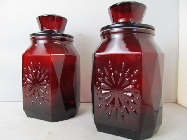 lot 20 image: Pair of Large Vintage Starburst Design Cranberry Glass Lidded Jars