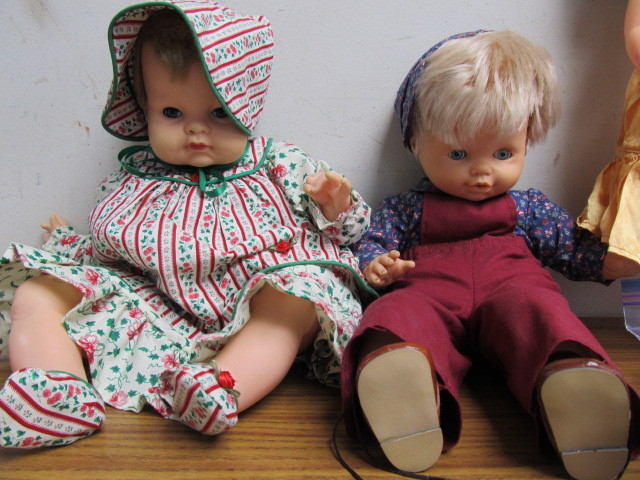 lot 187 image: Lot of Dolls and 9 Additional Full Sets of Doll Clothes
