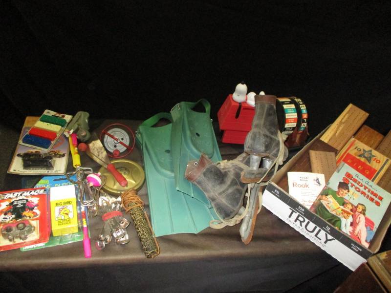 Vintage toys , lots of Hamms and Beer Bottle openers, cribbage boards, old iceskates, noise maker, old microphone, top and more